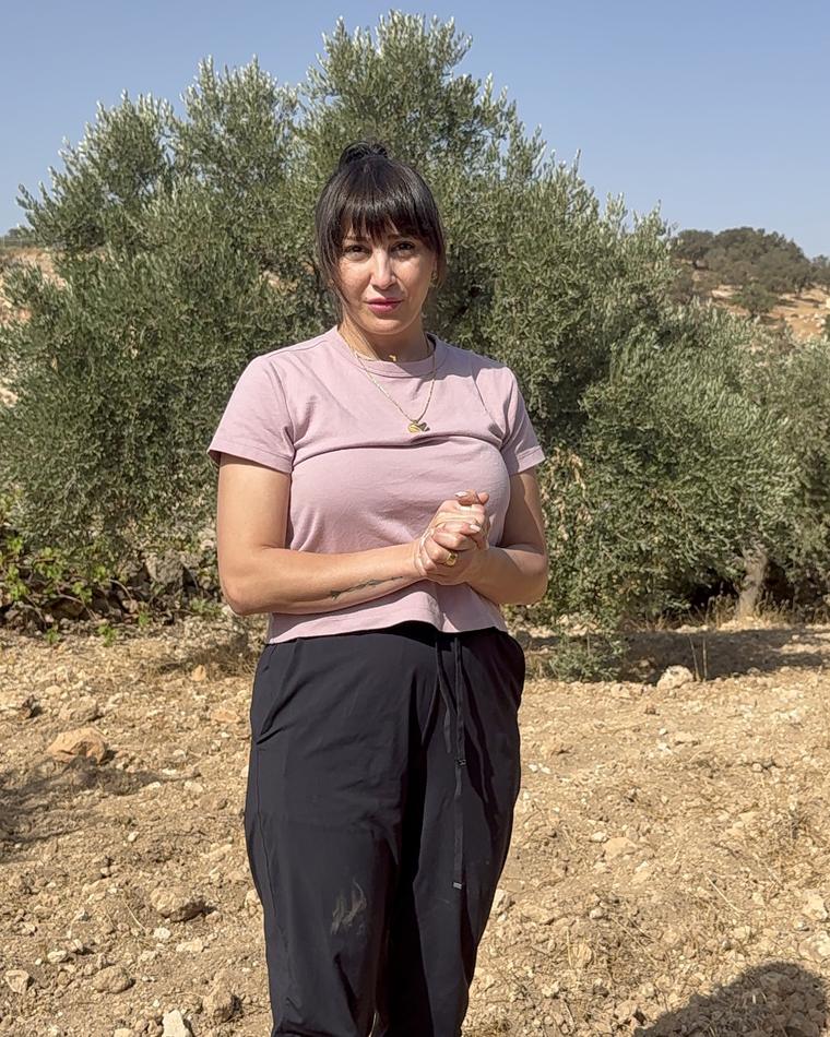 Sahar in the olive grove on the Al Hadaba hill