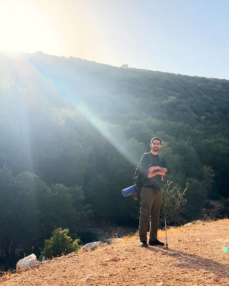 Standing in the sun rays on the ridge